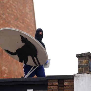 Banksys howling wolf artwork removed less than an hour after unveiling