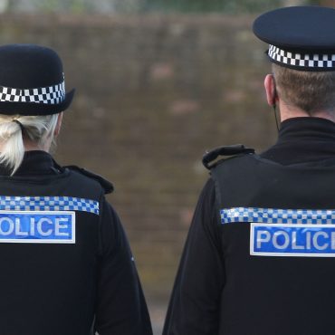Three children and man found dead in Surrey house