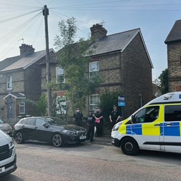 Floral tributes laid after man and three children found dead in house