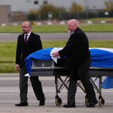 Alex Salmonds body met by family and piper as plane lands in Aberdeen